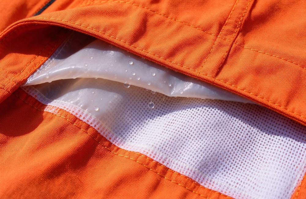 Front view of rescue suit three layer construction detail for technical orange rescue clothing breathability and rescue clothing protection performance verification for rescue clothing wholesale buyers