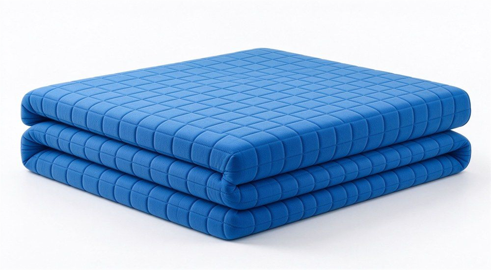 Blue check foam school mattress trifolded on white background for school mattress wholesale, showing foldable foam core design for bunk bed mattress supply to boarding schools